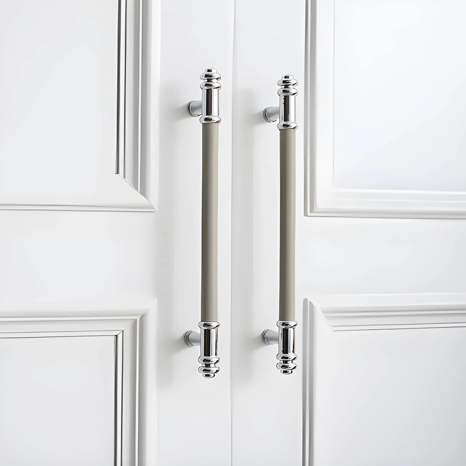 The Mantara L-0013 is a modern brass + leather handle in grey, ideal for kitchen drawers, dressers, and cabinets.