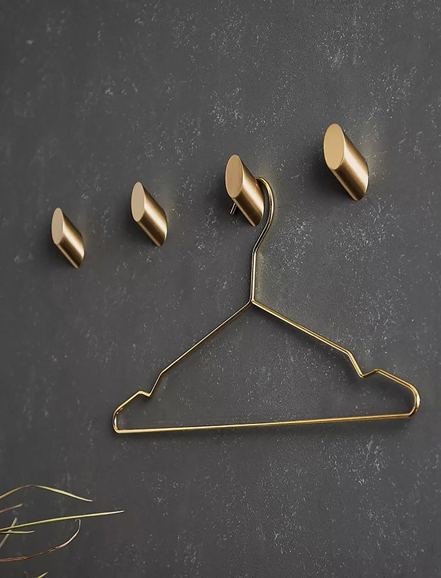 Mantara Hexa Hook B-0091 is a modern brushed brass wall hook in gold, perfect for bathrooms, bedrooms, and living areas.